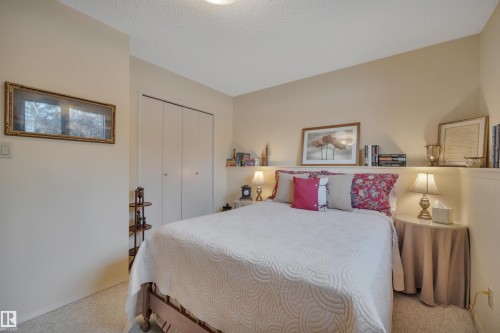 Bedroom with carpet flooring, a closet, and a textured ceiling - A49375 Rr 243, Rural Leduc County, AB 