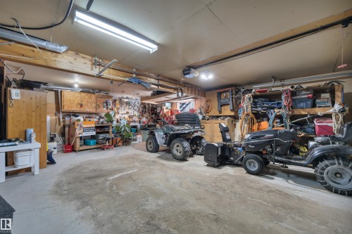 Garage with a workshop area and a garage door opener - A49375 Rr 243, Rural Leduc County, AB 