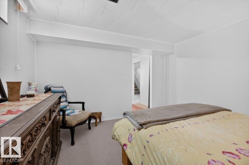 Carpeted room with white walls and a white ceiling - 10736 48 Street, Edmonton, AB 
