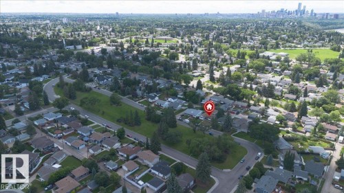 Aerial perspective showcasing a residential neighborhood with established trees and green spaces - 10736 48 Street, Edmonton, AB 