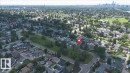 Aerial perspective showcasing a residential neighborhood with established trees and green spaces - 10736 48 Street, Edmonton, AB 