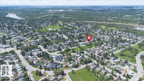 Aerial perspective showcasing an established residential neighborhood with mature trees and green spaces - 10736 48 Street, Edmonton, AB 