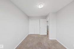 Neutral-toned carpeting and light gray walls create a versatile interior - 