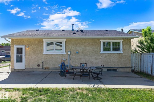 Rear exterior featuring stucco siding and an asphalt shingle roof - 17059 98 Street, Edmonton, AB - Outdoor
