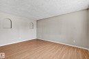 Spacious room with wood-finish flooring and neutral wall tones - 17059 98 Street, Edmonton, AB  - Indoor Photo Showing Other Room 