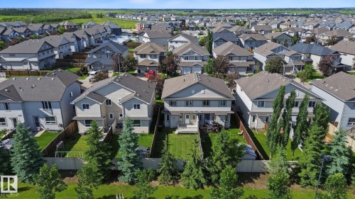 Residential neighborhood featuring a series of two-story homes with pitched roofs - 5205 168 Avenue, Edmonton, AB 
