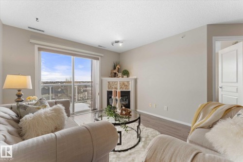 409 16035 132 Street, Edmonton, AB - Indoor Photo Showing Living Room With Fireplace