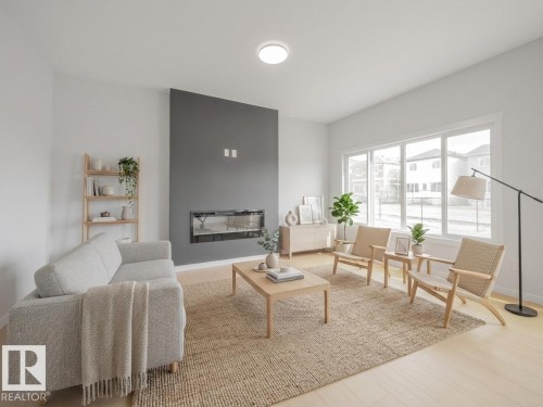 927 18 Avenue, Edmonton, AB - Indoor Photo Showing Living Room With Fireplace