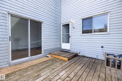 Outdoor wood deck area featuring light gray vinyl siding - 156 Lee Ridge Road, Edmonton, AB - Outdoor With Deck Patio Veranda With Exterior
