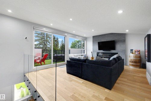 Top floor TV, party room. Wet bar, bathroom, fireplace, and outdoor patio area! - 7814 142 Street, Edmonton, AB 