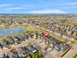 Modern suburban neighborhood featuring single-family residences and townhomes - 