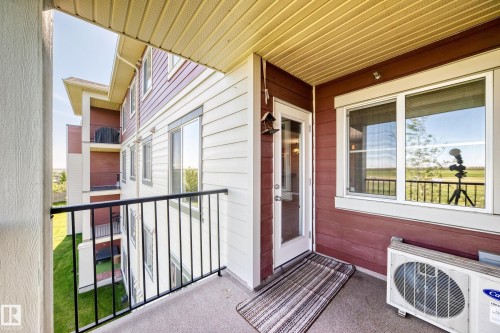 Private balcony featuring a concrete floor and black metal railings - 308 18126 77 Street, Edmonton, AB 