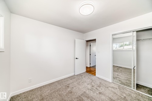 Carpeted room with white walls and trim - 4842 116Ave, Edmonton, AB - Indoor Photo Showing Other Room