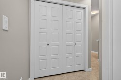 White bi-fold doors with panel detailing - 