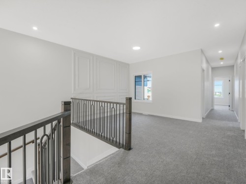Upper level landing featuring gray carpeting and white walls - 1717 Crossbill Loop, Edmonton, AB - Indoor Photo Showing Other Room