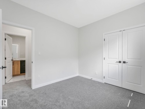 Carpeted room featuring light gray walls and white trim - 1717 Crossbill Loop, Edmonton, AB - Indoor Photo Showing Other Room