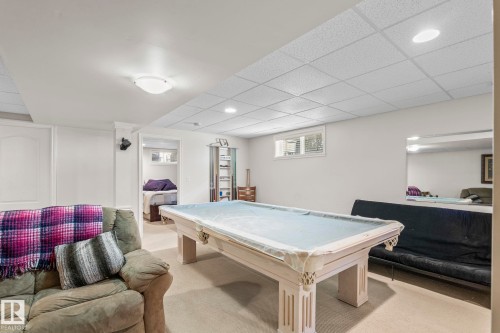 Finished basement space featuring recessed lighting, a drop ceiling, and carpeted flooring - 860 41 Avenue, Edmonton, AB 