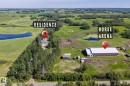 Expansive rural property featuring a main residence, a large horse arena building, a dedicated horse arena, and two distinct ponds - 860 41 Avenue, Edmonton, AB 