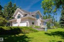 Stucco exterior with a multi-gabled roofline and attached two-car garage - 860 41 Avenue, Edmonton, AB 