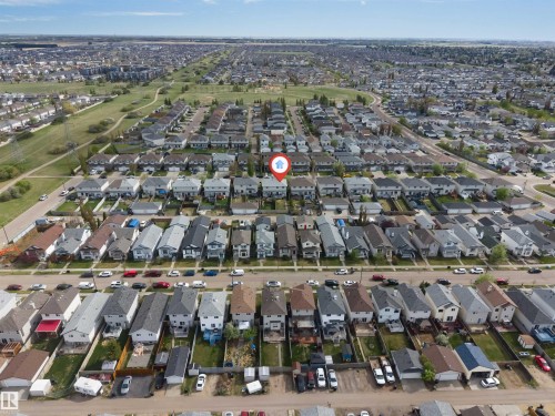 Aerial perspective of a residential community featuring rows of single-family homes with pitched roofs - 3032 31 Avenue, Edmonton, AB - Outdoor With View