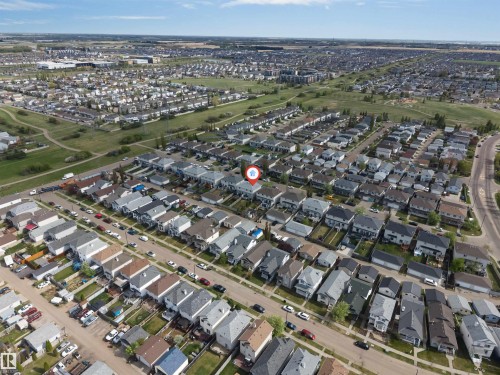Expansive aerial perspective showcasing a residential neighborhood with numerous single-family homes and green spaces - 3032 31 Avenue, Edmonton, AB - Outdoor With View