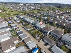 Aerial perspective showcasing a residential neighborhood with detached homes - 
