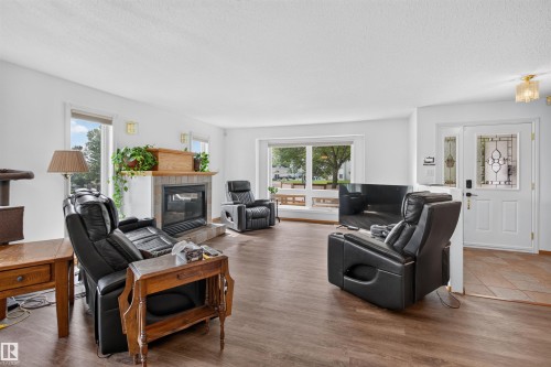 6000 54 Avenue, Camrose, AB - Indoor Photo Showing Living Room With Fireplace