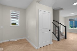 Herringbone wood-finish flooring provides a distinctive foundation - 