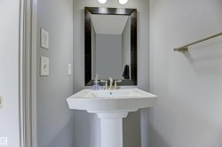 Pedestal sink with brushed nickel faucet - 