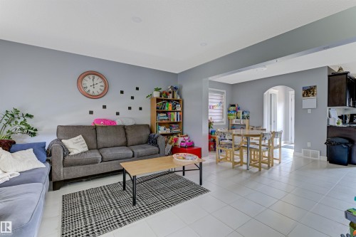Spacious interior featuring light-colored tile flooring throughout - 1311 30 Avenue, Edmonton, AB 