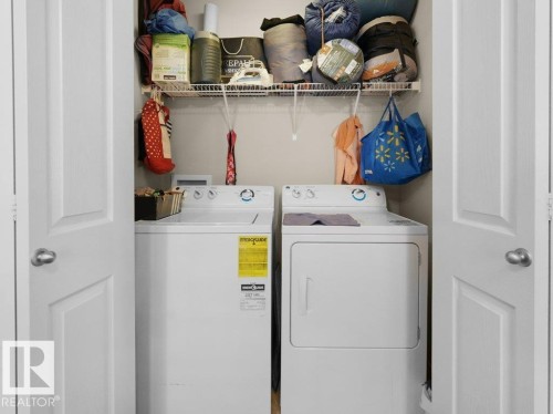 Dedicated laundry closet with bi-fold doors - 1419 27 Av, Edmonton, AB 
