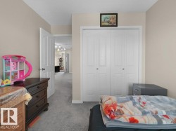 Carpeted room with neutral wall paint and textured ceiling - 