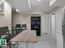 Finished interior space featuring light beige walls and recessed lighting - 