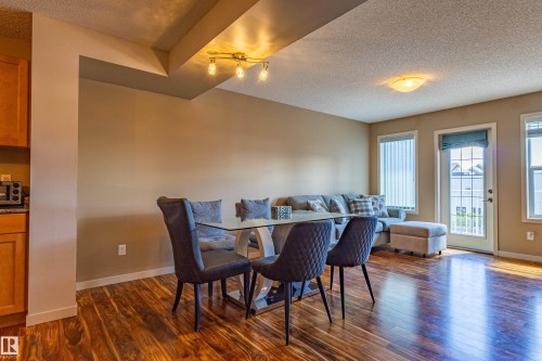 Open concept living area with wood-finish flooring - 13 1816 Rutherford Road, Edmonton, AB 