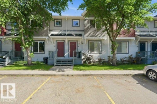 Multi-unit structure featuring light-colored siding and dark red entry doors - 30 1404 Hermitage Road, Edmonton, AB 