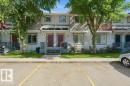 Multi-unit structure featuring light-colored siding and dark red entry doors - 30 1404 Hermitage Road, Edmonton, AB 