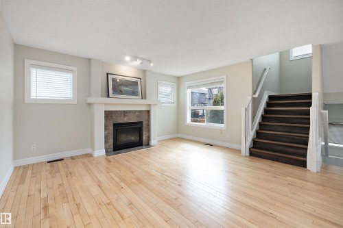 178 Woodbend Way, Fort Saskatchewan, AB - Indoor Photo Showing Living Room With Fireplace