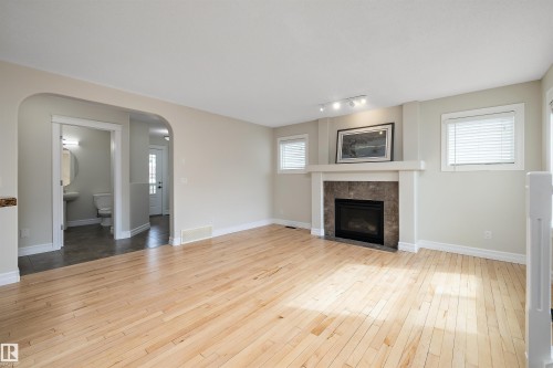 178 Woodbend Way, Fort Saskatchewan, AB - Indoor Photo Showing Living Room With Fireplace