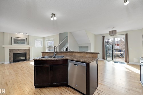 178 Woodbend Way, Fort Saskatchewan, AB - Indoor Photo Showing Other Room With Fireplace