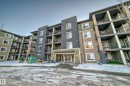 Multi-story residential building featuring a stone and siding exterior - 121 111 Watt Common, Edmonton, AB 