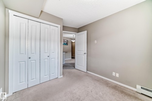 Light-colored carpeting complementing neutral wall tones - 121 111 Watt Common, Edmonton, AB 
