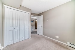 Light-colored carpeting complementing neutral wall tones - 