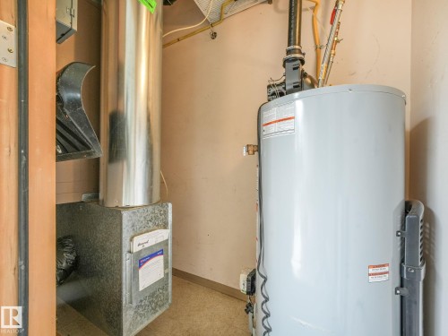 Water heater and furnace units within a utility space - 150 4827 104A Street, Edmonton, AB 