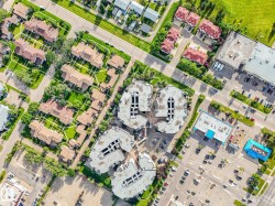 Aerial perspective showcasing a mixed-use community with residential and commercial properties - 