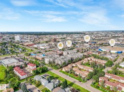 Aerial perspective showcasing a mixed-use urban landscape with commercial and residential properties - 