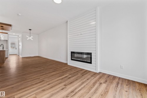 62 Juniper Wynd, Fort Saskatchewan, AB - Indoor Photo Showing Other Room With Fireplace