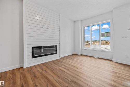 62 Juniper Wynd, Fort Saskatchewan, AB - Indoor Photo Showing Living Room With Fireplace