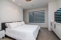 Recessed lighting complements a modern ceiling fixture - 