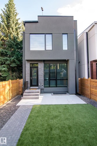 Modern gray stucco exterior with a flat roofline - 13218 102 Avenue, Edmonton, AB 