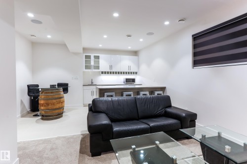 Entertainment room featuring recessed lighting and integrated ceiling speakers - 13218 102 Avenue, Edmonton, AB 